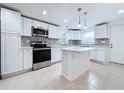 Modern kitchen with stainless steel appliances and white cabinetry at 1010 Martin Luther King Jr Blvd, Bartow, FL 33830