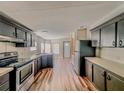 Spacious kitchen with stainless steel appliances and wood-look flooring at 408 Garrett Ridge Ct, Winter Haven, FL 33880