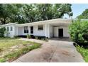 Front view of a renovated ranch home with carport at 905 14Th Ne St, Winter Haven, FL 33881