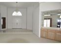 Spacious entryway with built-in shelving and tiled floors at 2418 Berkshire Dr, Winter Haven, FL 33884