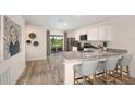 Modern kitchen with stainless steel appliances and granite countertops at 1250 Chester Ave, Haines City, FL 33844