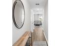 Bright hallway with wood-look floors and view into living room at 989 Ambleside Dr, Haines City, FL 33844