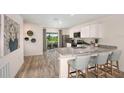 Modern kitchen with granite island and stainless appliances at 1021 Ambleside Dr, Haines City, FL 33844