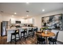 Modern kitchen with granite countertops and island seating at 1261 Chester Ave, Haines City, FL 33844