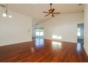 Spacious living room with hardwood floors and a ceiling fan at 8021 Princeton Manor Cir, Lakeland, FL 33809
