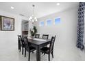 Formal dining room with a dark wood table and six chairs at 791 Terrapin Dr, Debary, FL 32713