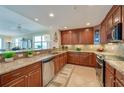 Modern kitchen with granite countertops and stainless steel appliances at 3801 S Atlantic Ave # 303, Daytona Beach Shores, FL 32118