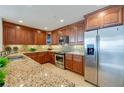 Modern kitchen with granite countertops and stainless steel appliances at 3801 S Atlantic Ave # 303, Daytona Beach Shores, FL 32118