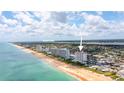 Aerial view of beachfront property, showing building location and surrounding area at 1183 Ocean Shore Blvd # 5050, Ormond Beach, FL 32176