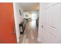 Bright condo entryway with wood-look floors at 231 Riverside Dr # 1106-1, Holly Hill, FL 32117