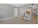 Modern kitchen with white cabinets and breakfast bar at 1415 Ocean Shore Blvd # 1112, Ormond Beach, FL 32176