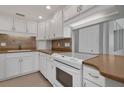 Updated kitchen with white cabinets and granite countertops at 1415 Ocean Shore Blvd # 1112, Ormond Beach, FL 32176