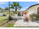 Elegant entryway with arched doorways and a beautifully landscaped courtyard at 3120 John Anderson Dr, Ormond Beach, FL 32176