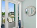 Bright entryway with a view of the street and decorative mirror at 4711 S Atlantic Ave, Ponce Inlet, FL 32127