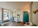 Bright enclosed patio with seating and access to the unit at 4575 S Atlantic Ave # 6310, Port Orange, FL 32127
