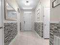 Bright entryway with gray stone wall accents at 225 Sunset Point Dr, Ormond Beach, FL 32174