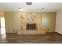 Stone fireplace creates a cozy focal point in the living room at 106 Banyan Dr, Ormond Beach, FL 32176