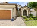 One-story home with a two-car garage and landscaped yard at 3240 Tralee Dr, Ormond Beach, FL 32174