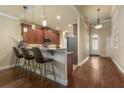 Modern kitchen with granite countertops, stainless steel appliances, and ample cabinetry at 3240 Tralee Dr, Ormond Beach, FL 32174