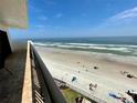 Ocean view from balcony, showing beach and waves at 2615 S Atlantic Ave # 7H, Daytona Beach, FL 32118
