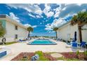 Community pool with lounge chairs and ocean view at 2850 Ocean Shore Blvd # 15C, Ormond Beach, FL 32176