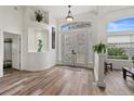 Bright and airy entryway with double doors and wood-look floors at 1273 Sunningdale Ln, Ormond Beach, FL 32174