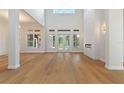 Spacious living room with hardwood floors and fireplace at 12245 Park Ave, Windermere, FL 34786