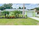 Bright green house with landscaped front yard at 54 Palmetto Dr, Ormond Beach, FL 32176