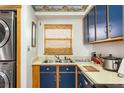 Efficient kitchen featuring blue cabinets and stainless steel appliances at 3170 Ocean Shore Blvd # 305, Ormond Beach, FL 32176