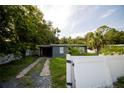 House exterior with a white fence and driveway at 809 Maley St, Daytona Beach, FL 32114
