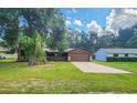 Ranch-style home with a spacious yard and driveway at 1119 Indigo Rd, Ormond Beach, FL 32174