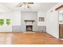 Simple living room with fireplace and wood floors at 321 Cedar St, Daytona Beach, FL 32114