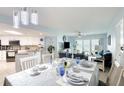 Bright dining area with table set for dinner, adjacent to kitchen at 2937 S Atlantic Ave # 1504, Daytona Beach, FL 32118