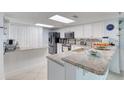 Modern kitchen with granite countertops and stainless steel appliances at 2937 S Atlantic Ave # 1504, Daytona Beach, FL 32118