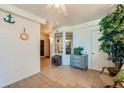 Sunroom with tiled floor and access to the balcony at 4555 S Atlantic Ave # 4304, Ponce Inlet, FL 32127