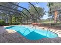 Inviting screened pool with a large patio area at 1458 Dolph Cir, Ormond Beach, FL 32174