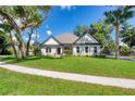 Single-story home with landscaped yard and driveway at 10 Whitehall Ct, Flagler Beach, FL 32136