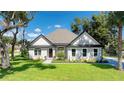 Single-story home with landscaped yard and driveway at 10 Whitehall Ct, Flagler Beach, FL 32136
