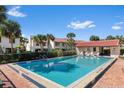 Inviting community pool with lounge chairs and a lifeguard station at 2934 Oceans Trce, Daytona Beach, FL 32118