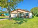 One-story house with a landscaped yard and driveway at 322 Acacia Dr, Port Orange, FL 32127