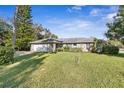 Charming brick home with a large front yard at 203 N Duss St, New Smyrna Beach, FL 32168