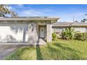 Brick home with a welcoming front porch at 203 N Duss St, New Smyrna Beach, FL 32168