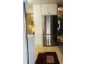 Modern kitchen with stainless steel appliances and white cabinets at 216 Rue De Paresse, Tavares, FL 32778