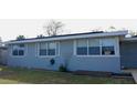 Single-story home with a gray exterior and well-maintained lawn at 1114 Berkshire Rd, Daytona Beach, FL 32117