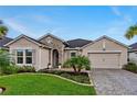 Beautiful home with stone accents and landscaping at 597 Mosaic Blvd, Daytona Beach, FL 32124