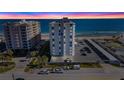Aerial view of Regency Plaza at sunset, showcasing the oceanfront location at 1415 Ocean Shore Blvd # B030, Ormond Beach, FL 32176
