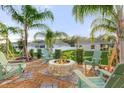 Relaxing backyard with fire pit and seating area at 2214 Elegant Manor Cir, Edgewater, FL 32141