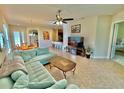 Bright and airy living room with a comfortable seating area and open floor plan at 708 Aldenham Ln, Ormond Beach, FL 32174
