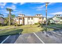 Two-story building exterior, well-maintained landscaping at 133 Blue Heron Dr # C, Daytona Beach, FL 32119