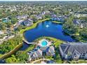 Luxury community with lake, pool, and lush landscaping at 940 Village Trail # 7-107, Port Orange, FL 32127